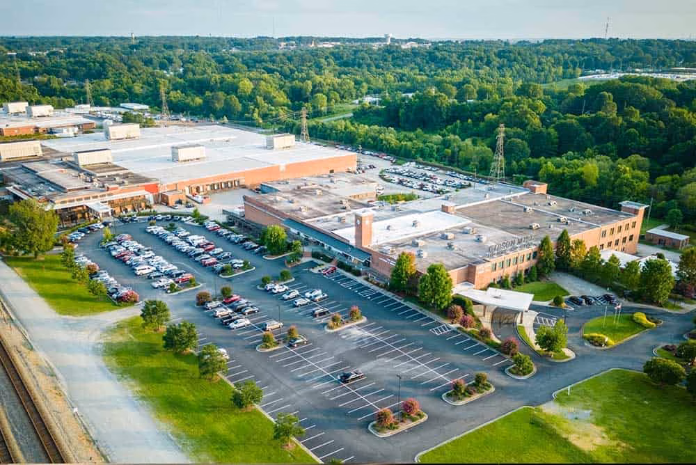 Founded in 1899 by businessman R.E. Gibson, in partnership with industrialist James Cannon, the facility began as the Gibson Manufacturing Company. It later became Plant No. 6 within the Cannon Mills network.